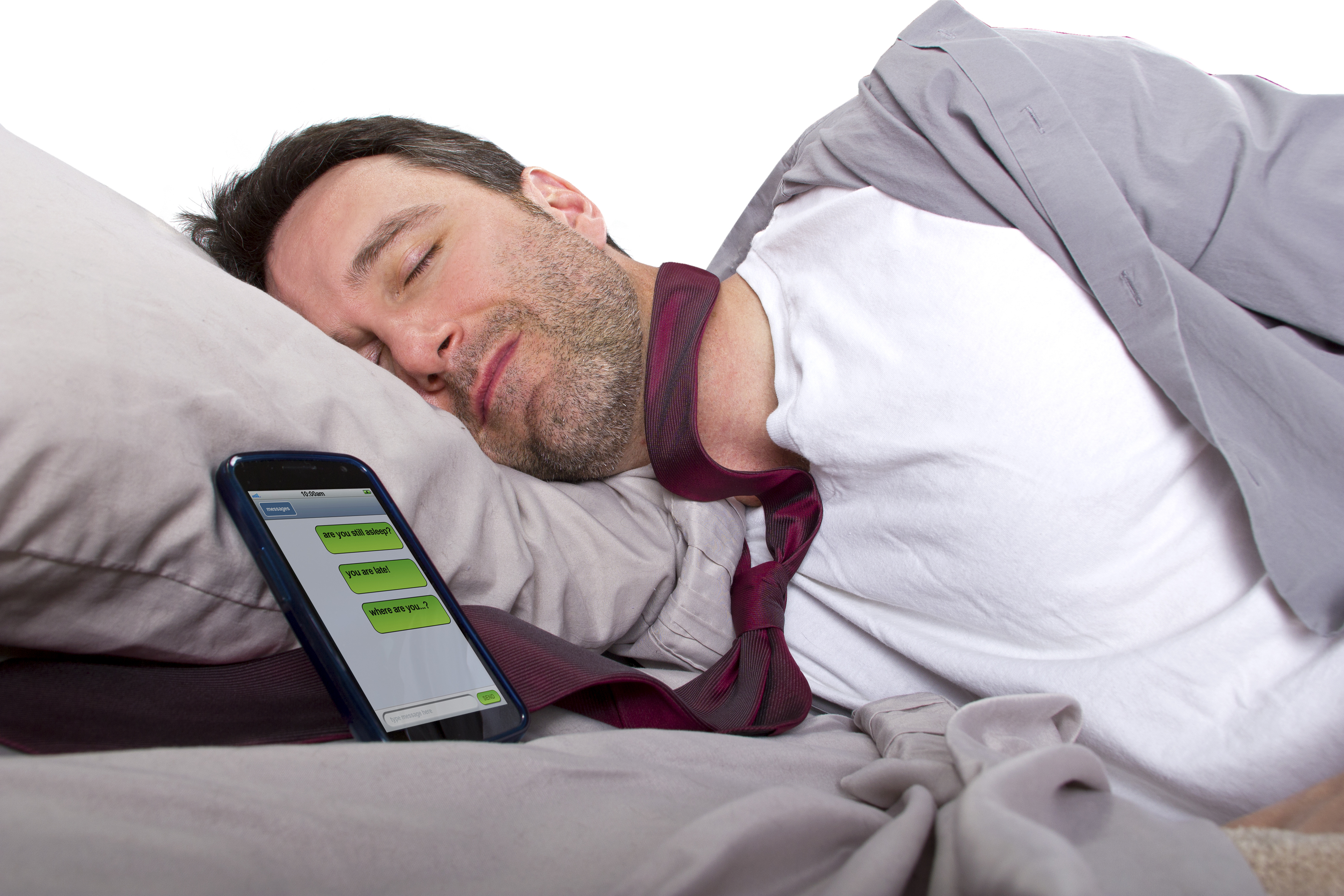 Man sleeping and receiving text messages from work